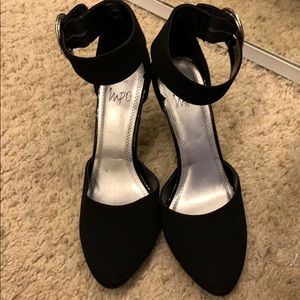 Black pumps with ankle strap